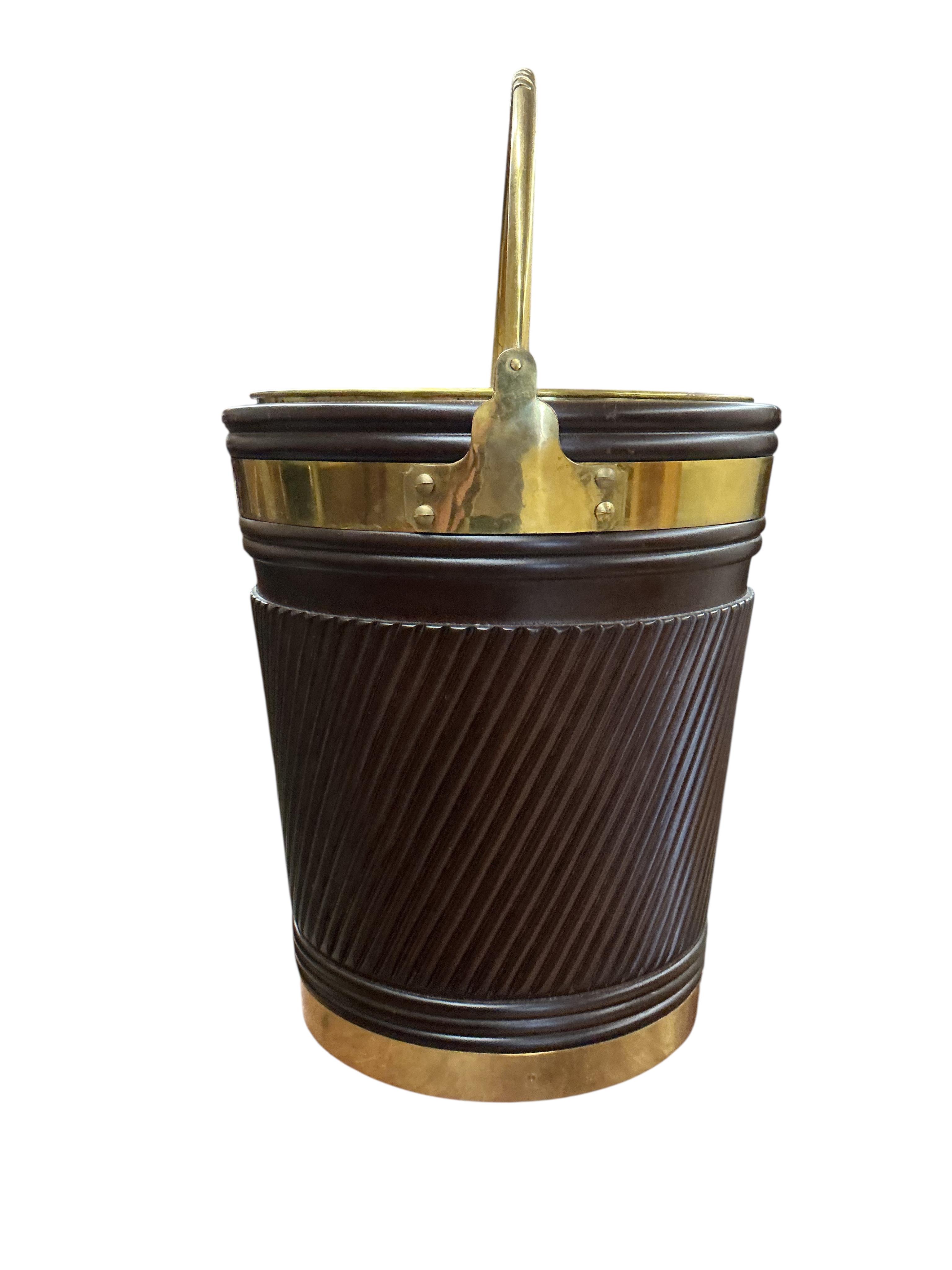A large reproduction George III Irish style brass bound mahogany peat bucket with brass liner, diameter 46cm, height 53cm